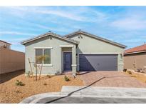 Charming single-story home featuring a two-car garage and desert landscaping at 2721 Avril Point St, Las Vegas, NV 89156