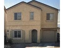 Two-story home with an attached garage and a neutral color scheme at 4181 Puebla St, Las Vegas, NV 89115