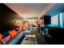 Contemporary living room featuring an open layout, fireplace and a spectacular view from floor to ceiling windows at 4381 W Flamingo Rd # 2902, Las Vegas, NV 89103