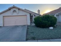 Charming single story home with a two car garage, desert landscaping, and stucco exterior at 5429 Chela Dr, Las Vegas, NV 89120