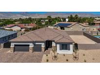 Charming single-story home with a paver driveway, two-car garage, and desert landscaping at 5851 Slate Rock Ct, Las Vegas, NV 89149