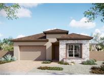 Charming single-story home featuring stone accents, a two-car garage, and low-maintenance landscaping at 881 Cottonwood Hill Pl, Henderson, NV 89011
