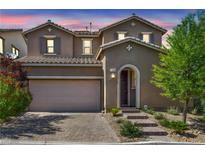 Charming two-story home with a well-manicured front yard and a welcoming entrance at 12290 Terrace Verde Ave, Las Vegas, NV 89138