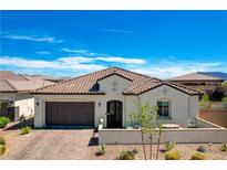 Charming single-story home featuring a tile roof, stucco exterior, and a well-maintained front yard at 129 Major Bowling Pl, Henderson, NV 89011