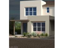Modern home exterior with desert landscaping and stylish architectural details creating a welcoming curb appeal at 1491 Melodic Lark Dr, Las Vegas, NV 89138