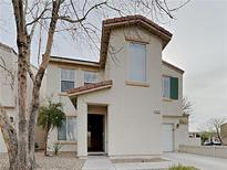 Inviting two-story home with a charming front entrance and desert landscaping at 2132 Tierra Del Verde St, Las Vegas, NV 89156