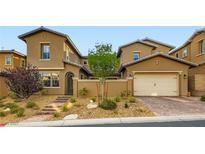 Charming two-story home with well-manicured landscaping and inviting curb appeal at 391 Capistrano Vistas St, Las Vegas, NV 89138