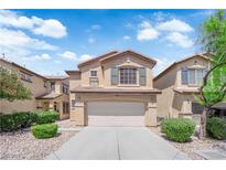 Charming two-story home featuring a two-car garage, manicured landscaping, and a welcoming front porch at 5653 Mount Athos St, North Las Vegas, NV 89031