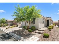 Charming single-story home featuring desert landscaping and a well-manicured front yard at 5936 Bruselas St, Las Vegas, NV 89113