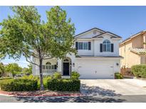 Charming two-story home with a well-manicured lawn and beautiful landscaping at 7849 Meandering Light Ave, Las Vegas, NV 89131
