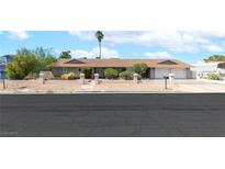 Charming single-story home with desert landscaping and a two-car garage at 120 W Highland Dr, Henderson, NV 89015