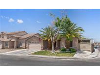 Charming single-Gathering home with mature landscaping, two-car garage, and an inviting entryway at 1310 Ripplestone Ave, North Las Vegas, NV 89081
