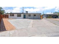 Charming single-story home featuring a spacious driveway and a neatly landscaped front yard at 1313 Purple Sage Ave, Las Vegas, NV 89108