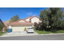 Charming single-Gathering home with a tile roof, two car garage and well-maintained landscaping at 1330 Honey Lake St, Las Vegas, NV 89110