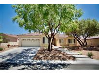 Charming single-story home featuring a well-maintained front yard and a two-car garage at 1830 Lake Wales St, Henderson, NV 89052