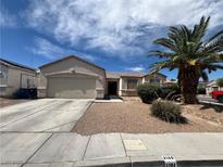 Charming single-story home featuring a low maintenance front yard, and a welcoming two-car garage at 3108 Sentimental Ct, North Las Vegas, NV 89031