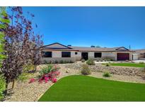 Charming single-story home features a well-maintained yard with lush greenery and desert landscaping at 3917 Leon Ave, Las Vegas, NV 89130