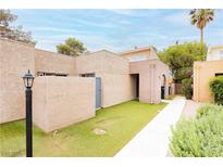 Charming single-story home with a well-maintained front yard and inviting walkway to the front door at 4232 Park Ct, Las Vegas, NV 89110