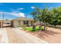 Charming single-story home with manicured front yard, inviting porch, and ample parking at 531 New Mexico St, Boulder City, NV 89005