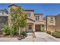 Charming two-story home featuring a balcony, covered parking, and a well-maintained front yard at 9104 Pearl Cotton Ave, Las Vegas, NV 89149