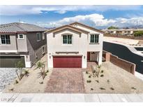 Inviting two-story home features a paver driveway, low maintenance landscaping, and a two-car garage at 1301 Miller Springs Ln # Lot 93, North Las Vegas, NV 89084