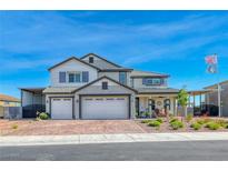 Beautiful two-story home with a three-car garage, covered car port and a charming front porch at 1523 Great Sands St, Boulder City, NV 89005