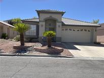 Charming single-story home featuring well-manicured landscaping and an attached two-car garage at 1617 Stonefield St, Las Vegas, NV 89144