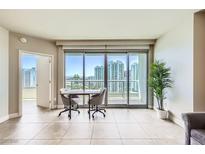 Bright living room with tile floors, floor to ceiling windows, and stunning city views at 222 Karen Ave # 2305, Las Vegas, NV 89109
