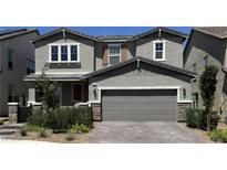 Two-story home with a gray exterior, a two-car garage, and manicured landscaping at 2645 Cava Tirreni St, Henderson, NV 89044
