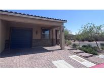 Charming single-story home featuring a two-car garage and stone accents at 2653 Crystal Blue St, Laughlin, NV 89029