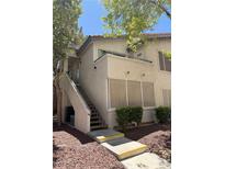 Charming condo exterior with private entry stairs and well-maintained landscaping at 3055 Key Largo Dr # 204, Las Vegas, NV 89120