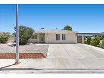 Charming single-story home with a well-maintained front yard and long driveway at 321 Oil Lantern Ln, Las Vegas, NV 89145
