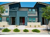 Inviting townhome featuring contemporary design and landscaping, with vibrant accents and a welcoming entrance at 3763 Sonrisa Vista Ave, Henderson, NV 89044