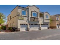 Well-maintained stucco building with individual garages in a desirable neighborhood with manicured landscaping at 3936 Pepper Thorn Ave # 3, North Las Vegas, NV 89081