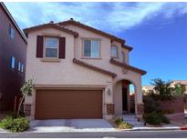 Charming two-story home with a two-car garage and well-maintained landscaping at 7468 Wellfleet Bay Ave, Las Vegas, NV 89179