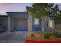 Charming single-story home with a well-manicured front yard and a private two-car garage at 7533 Garnet Moon St, North Las Vegas, NV 89084