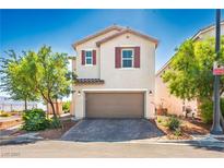 Charming two-story home with desert landscaping, and a brown garage door at 7990 Formitch Ct, Las Vegas, NV 89166
