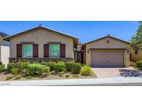 Charming single-story home with well-maintained landscaping and a two-car garage at 800 Rosewater Dr, Henderson, NV 89011