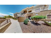 Two-story condo featuring desert landscaping and a private entrance, blending style and low-maintenance living at 8070 W Russell Rd # 1046, Las Vegas, NV 89113