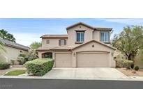 Charming two-story home with a three-car garage and well-manicured landscaping at 9044 Blue Raven Ave # R, Las Vegas, NV 89143