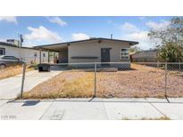 Charming single story home featuring a covered parking area and a chain link fence at 104 Stanford St, Las Vegas, NV 89107