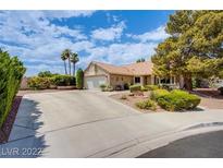 Inviting single-story home with well-manicured landscaping and a spacious driveway at 151 Enloe St, Henderson, NV 89074