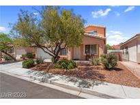 Charming single-Gathering home featuring a manicured front yard, mature tree, and cozy front porch at 2366 Brockton Way, Henderson, NV 89074