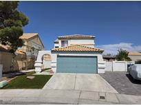 Charming two-story home featuring an attached two-car garage and a well-manicured lawn at 332 Dockside Ct, Las Vegas, NV 89145