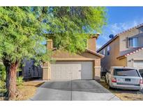 Charming two-story home with a two-car garage and well-maintained landscaping at 4215 Macadamia Dr, Las Vegas, NV 89115