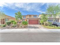 Charming two-story home featuring a well-manicured front yard and brick paved driveway at 4332 Stardusk Falls Ave, North Las Vegas, NV 89084