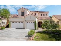 Charming two-story home with a well-manicured lawn and three-car garage at 532 Kavanagh Pl, Las Vegas, NV 89123