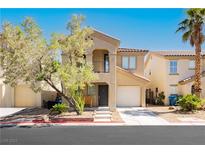 Charming two-story home featuring desert landscaping, two-car garages, and a cozy front porch, creating an inviting curb appeal at 551 Swiss Cottage Ave, Las Vegas, NV 89178