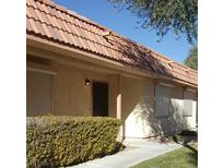 Inviting single-story home with neutral-toned exterior, well-maintained landscaping, and a classic terracotta tile roof at 728 Apple Tree Ct, Henderson, NV 89014