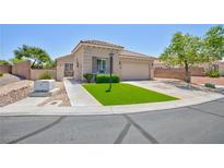 Charming single-story home with well-maintained landscaping and a welcoming entrance on a sunny day at 7816 Glowing Peak St, Las Vegas, NV 89131